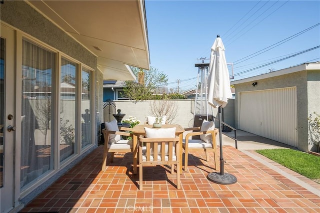 view of patio featuring fence