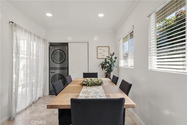 dining space featuring baseboards, light tile patterned flooring, recessed lighting, ornamental molding, and stacked washer / dryer