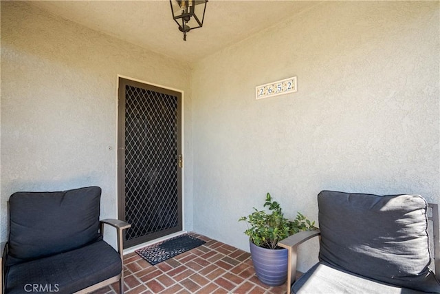 property entrance featuring stucco siding