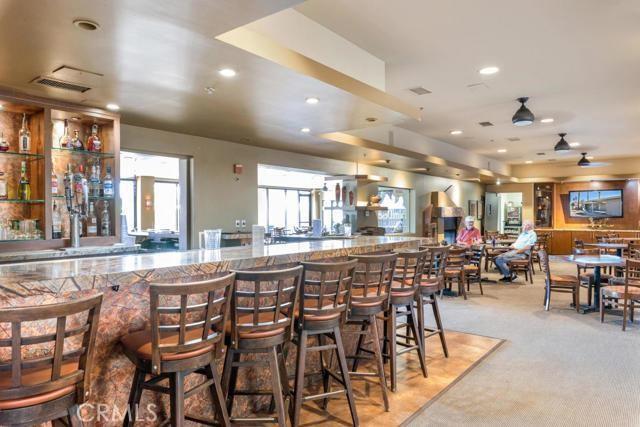 interior space with stone countertops, recessed lighting, a ceiling fan, visible vents, and carpet