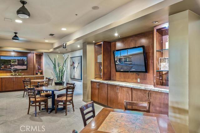 dining area featuring light colored carpet and recessed lighting