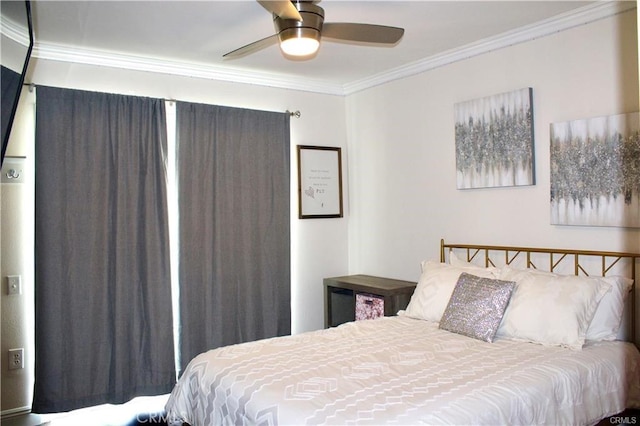 bedroom featuring a ceiling fan and crown molding