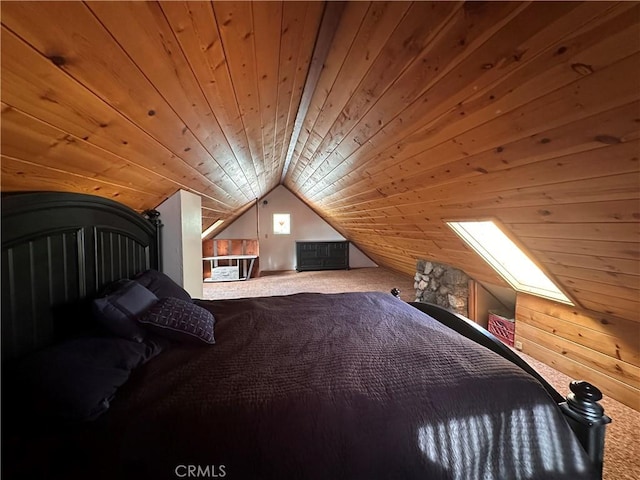 unfurnished bedroom with vaulted ceiling, carpet, and wood ceiling