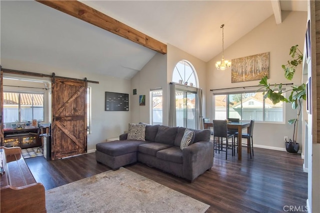 living room with a barn door, beam ceiling, a notable chandelier, high vaulted ceiling, and dark wood-style flooring