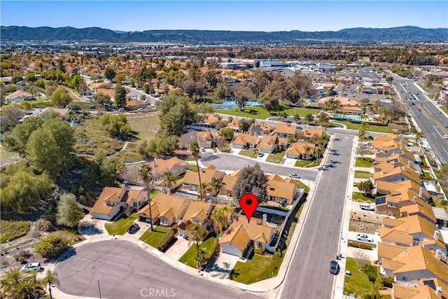 birds eye view of property featuring a mountain view and a residential view