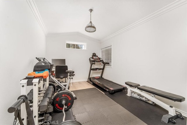 workout room featuring lofted ceiling, baseboards, and crown molding