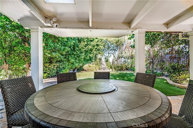 view of patio / terrace featuring fence and outdoor dining space