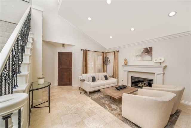 living area with stairs, baseboards, crown molding, and a glass covered fireplace