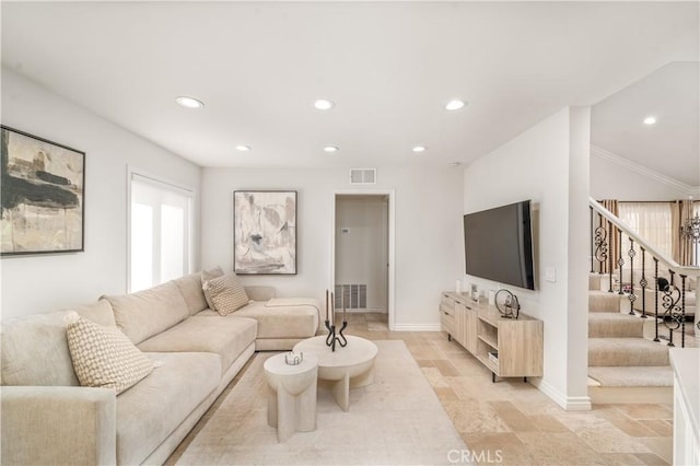 living area with visible vents, baseboards, stairway, stone finish flooring, and recessed lighting