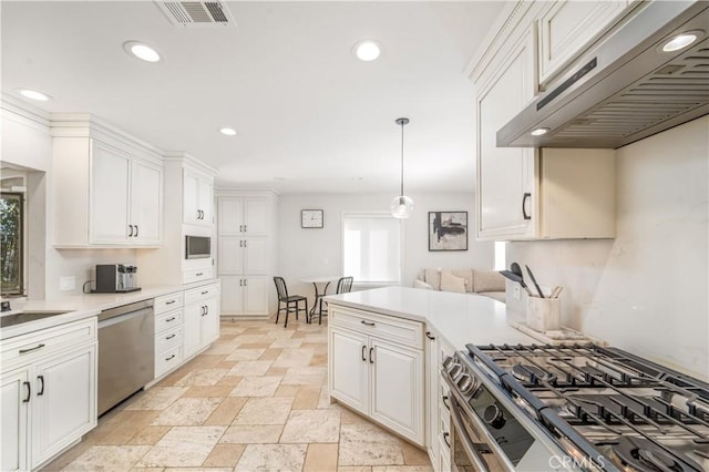 kitchen featuring visible vents, appliances with stainless steel finishes, light countertops, under cabinet range hood, and recessed lighting