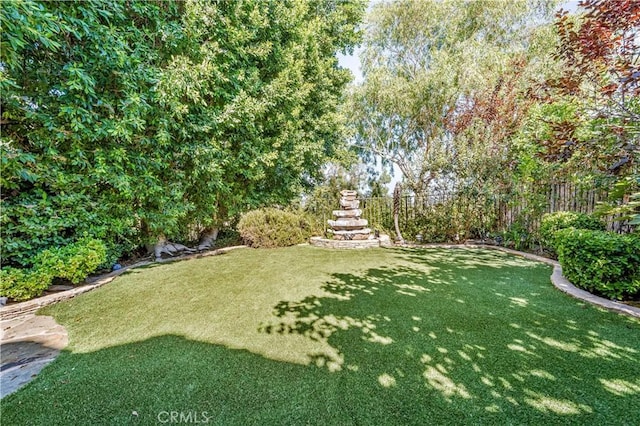 view of yard featuring fence