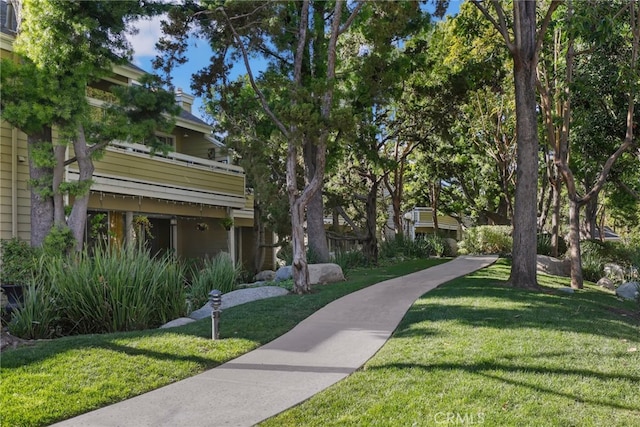 view of home's community with a lawn