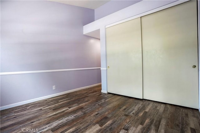 3690 S Bear St Unit 5, Santa Ana, CA 92704 - unfurnished bedroom with baseboards, a closet, and wood finished floors