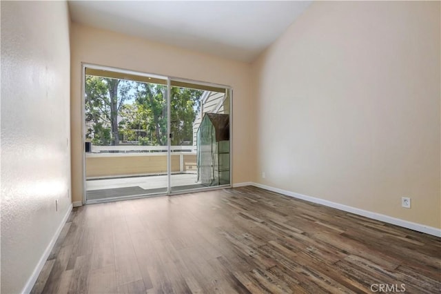 3690 S Bear St Unit 5, Santa Ana, CA 92704 - spare room featuring baseboards and wood finished floors