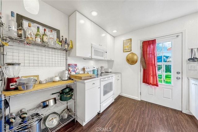 kitchen featuring light countertops, white appliances, dark wood finished floors, and white cabinets