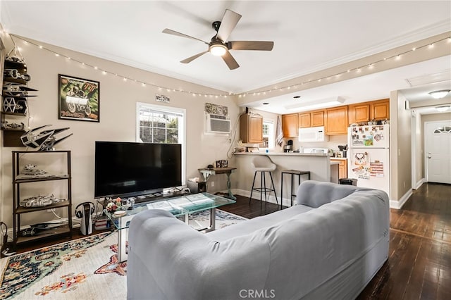 living room featuring dark wood-type flooring, ornamental molding, and baseboards