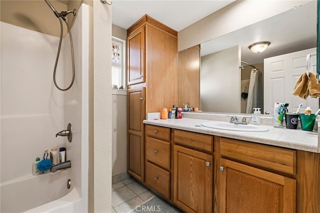 full bathroom featuring tile patterned flooring, shower / bath combo with shower curtain, and vanity