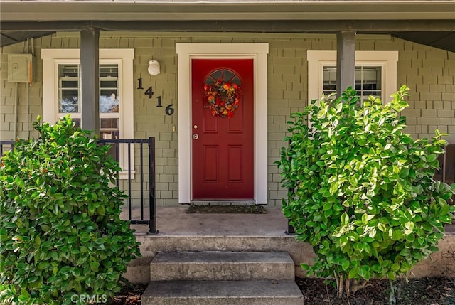 property entrance featuring covered porch