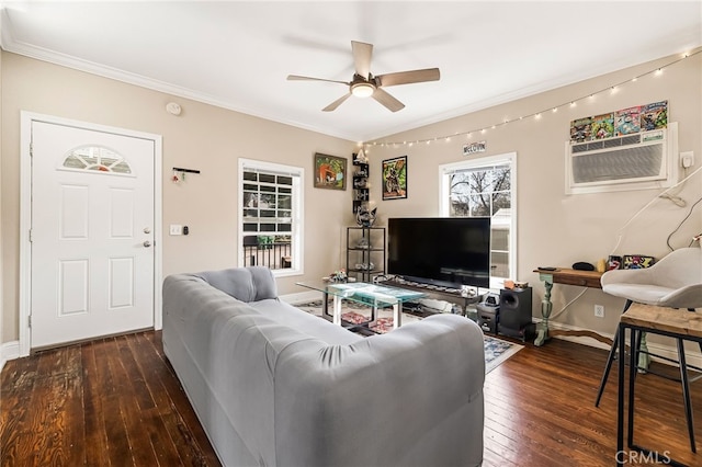 living room with a ceiling fan, baseboards, ornamental molding, a wall mounted AC, and hardwood / wood-style floors