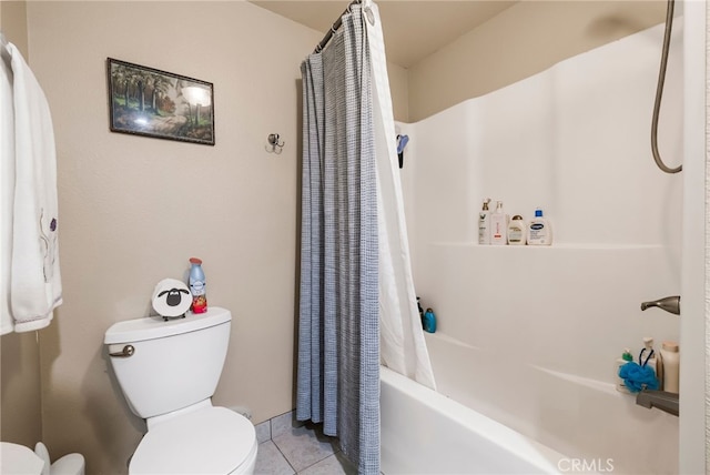 bathroom featuring shower / bath combo with shower curtain, tile patterned flooring, and toilet