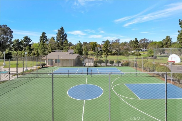 view of sport court with community basketball court and fence