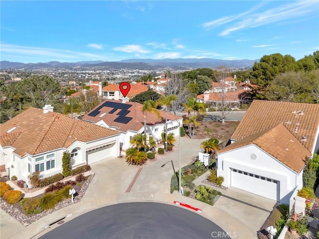 drone / aerial view with a residential view and a mountain view