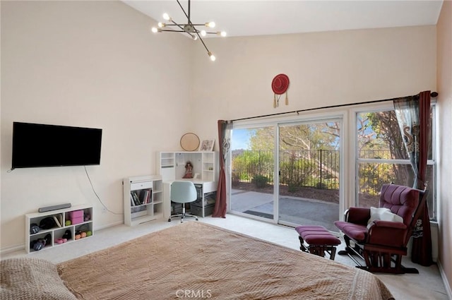 carpeted bedroom featuring access to exterior, a notable chandelier, high vaulted ceiling, and baseboards