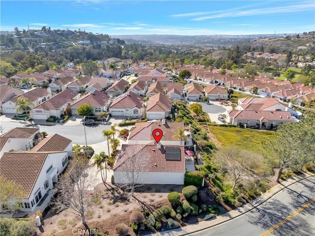 birds eye view of property with a residential view