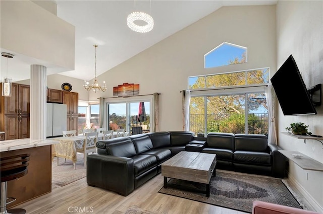 1268 Via, San Jacinto, San Marcos, CA 92078 - living room with a chandelier, high vaulted ceiling, and light wood finished floors