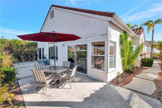 view of patio / terrace featuring outdoor dining space and fence