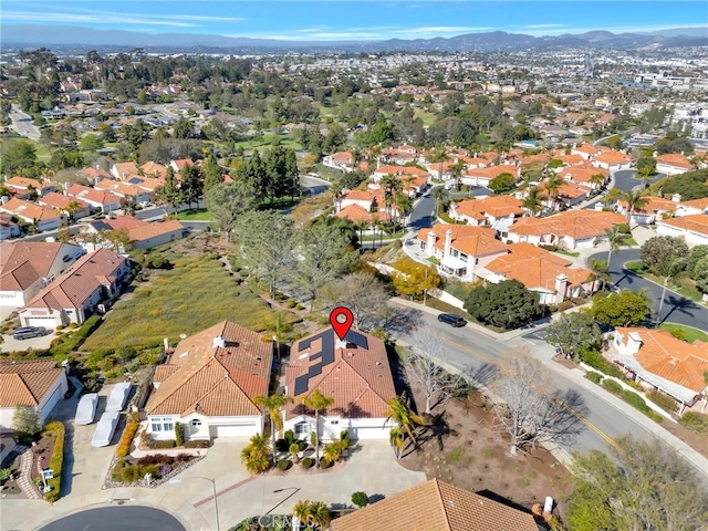 birds eye view of property with a residential view and a mountain view