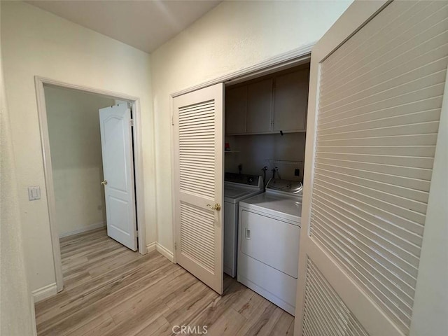 1268 Via, San Jacinto, San Marcos, CA 92078 - laundry room with cabinet space, light wood finished floors, and independent washer and dryer