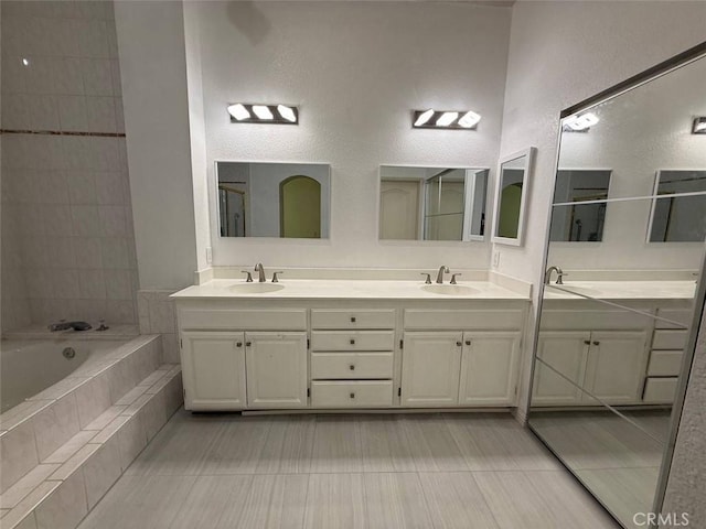 1268 Via, San Jacinto, San Marcos, CA 92078 - full bath with double vanity, a bath, tile patterned floors, and a textured wall