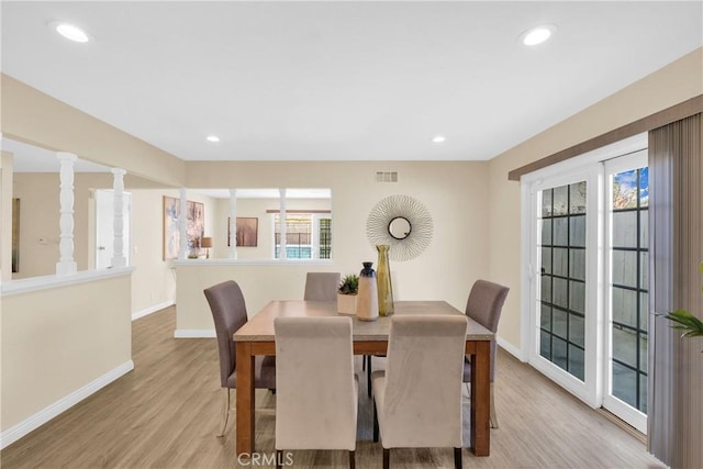 dining room with light wood-style floors, recessed lighting, visible vents, and baseboards