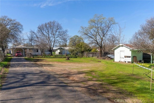 view of street featuring aphalt driveway