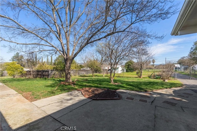 view of yard featuring a patio area and fence