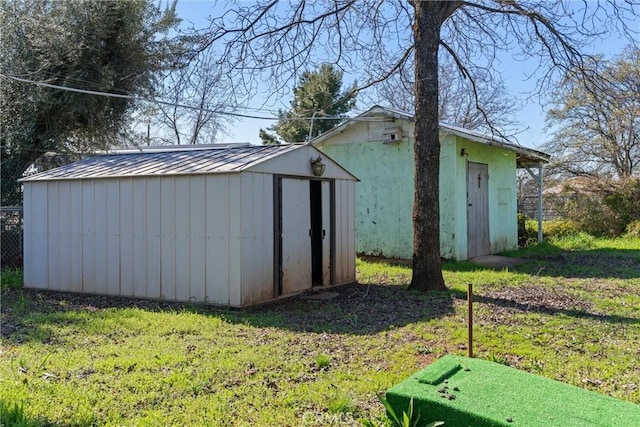 view of shed with fence