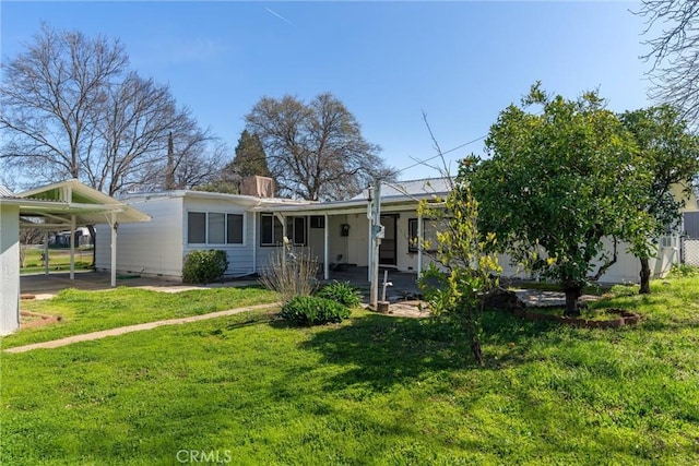 ranch-style house with an attached carport, crawl space, a chimney, and a front lawn