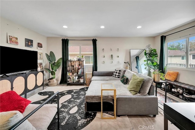 living room with recessed lighting and wood finished floors