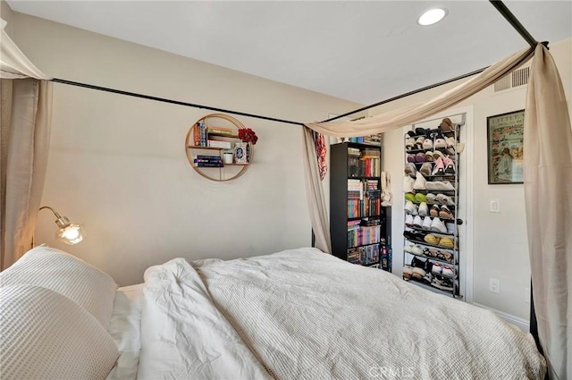 bedroom with recessed lighting and visible vents