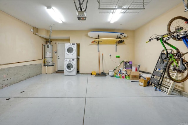 garage with strapped water heater, stacked washer / dryer, and a garage door opener