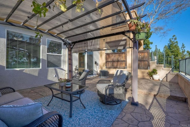 view of patio with central AC unit and a pergola