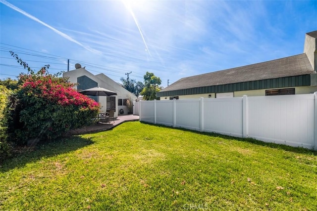 view of yard with a patio area and fence