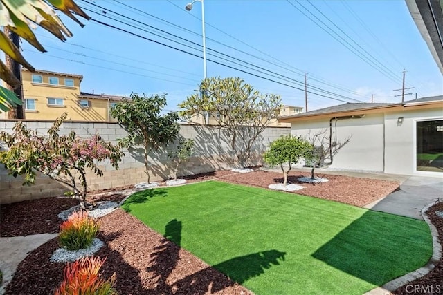 view of yard with a fenced backyard