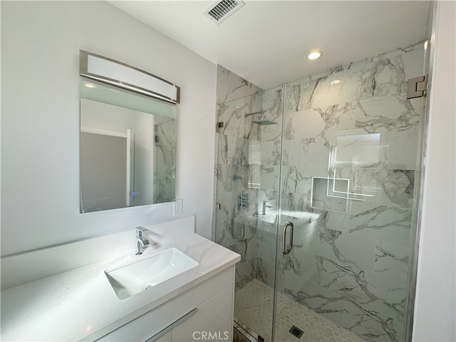 full bathroom with recessed lighting, visible vents, vanity, and a marble finish shower