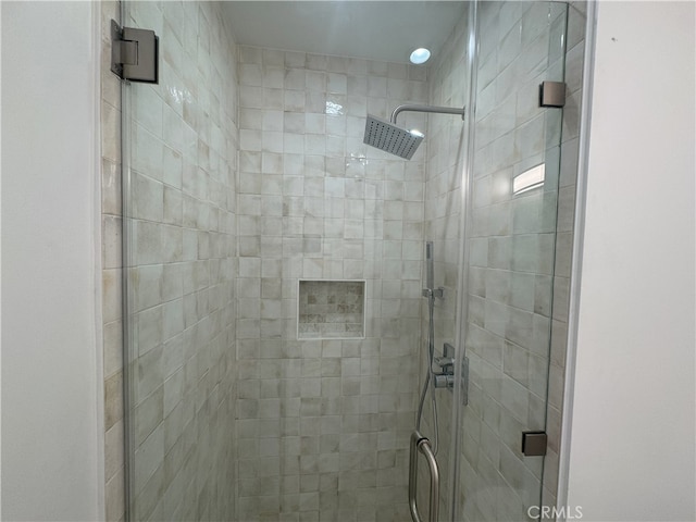 bathroom featuring a shower stall