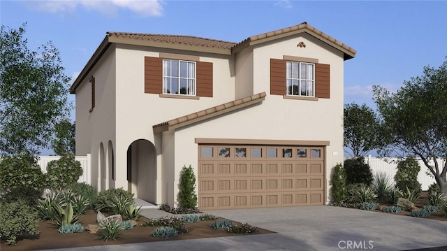 mediterranean / spanish home with a garage, concrete driveway, a tiled roof, and stucco siding