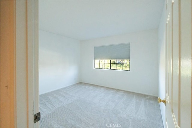 20271 Sealpoint Unit 104, Huntington Beach, CA 92646 - carpeted empty room with baseboards