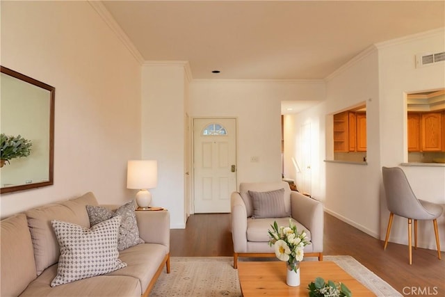 20271 Sealpoint Unit 104, Huntington Beach, CA 92646 - living area featuring ornamental molding, visible vents, wood finished floors, and baseboards