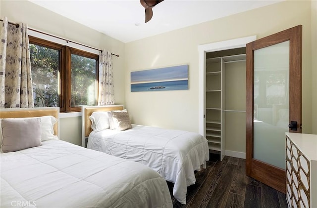 bedroom with ceiling fan, a closet, and wood finished floors